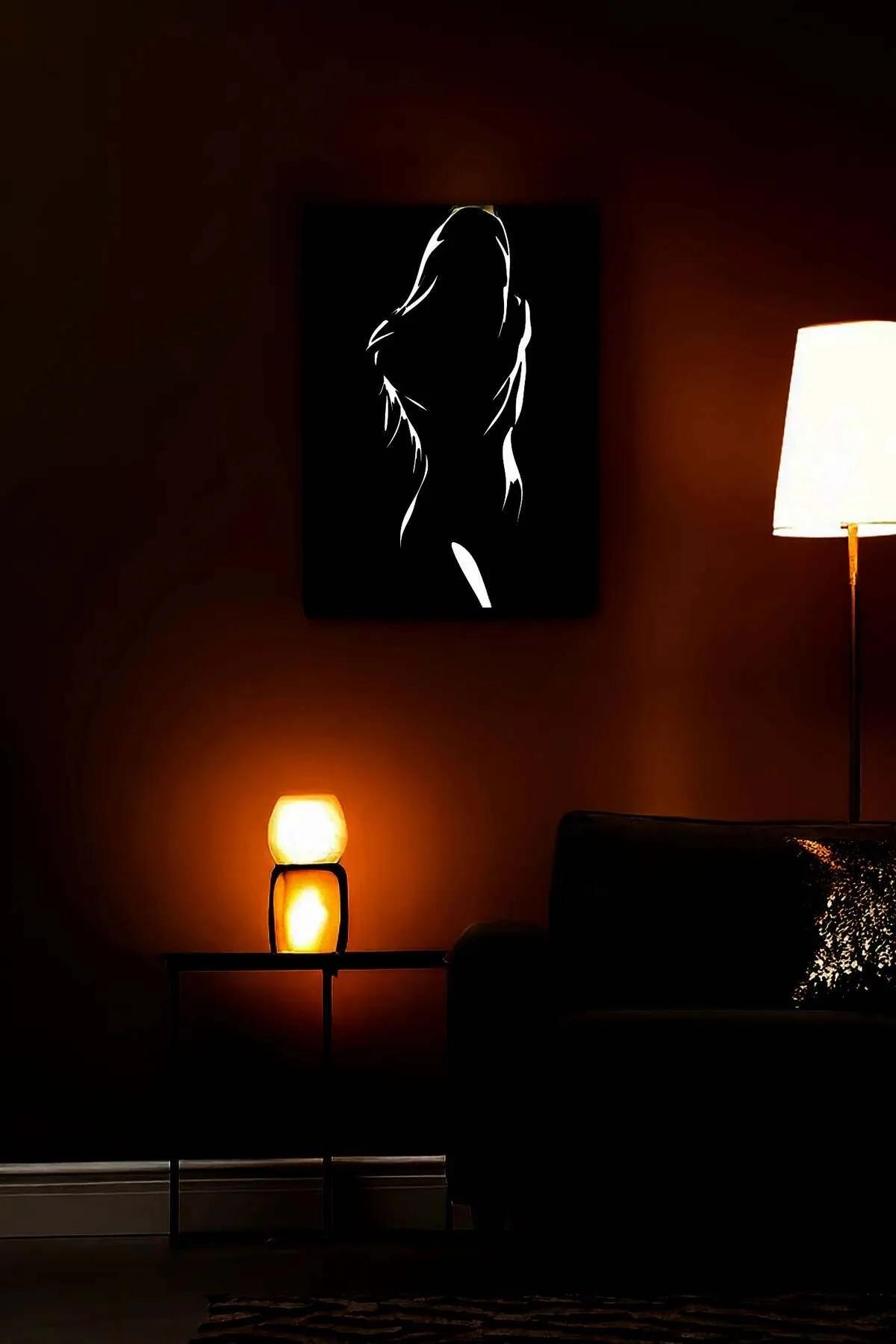 Reflective Female Silhouette Art on Black Canvas