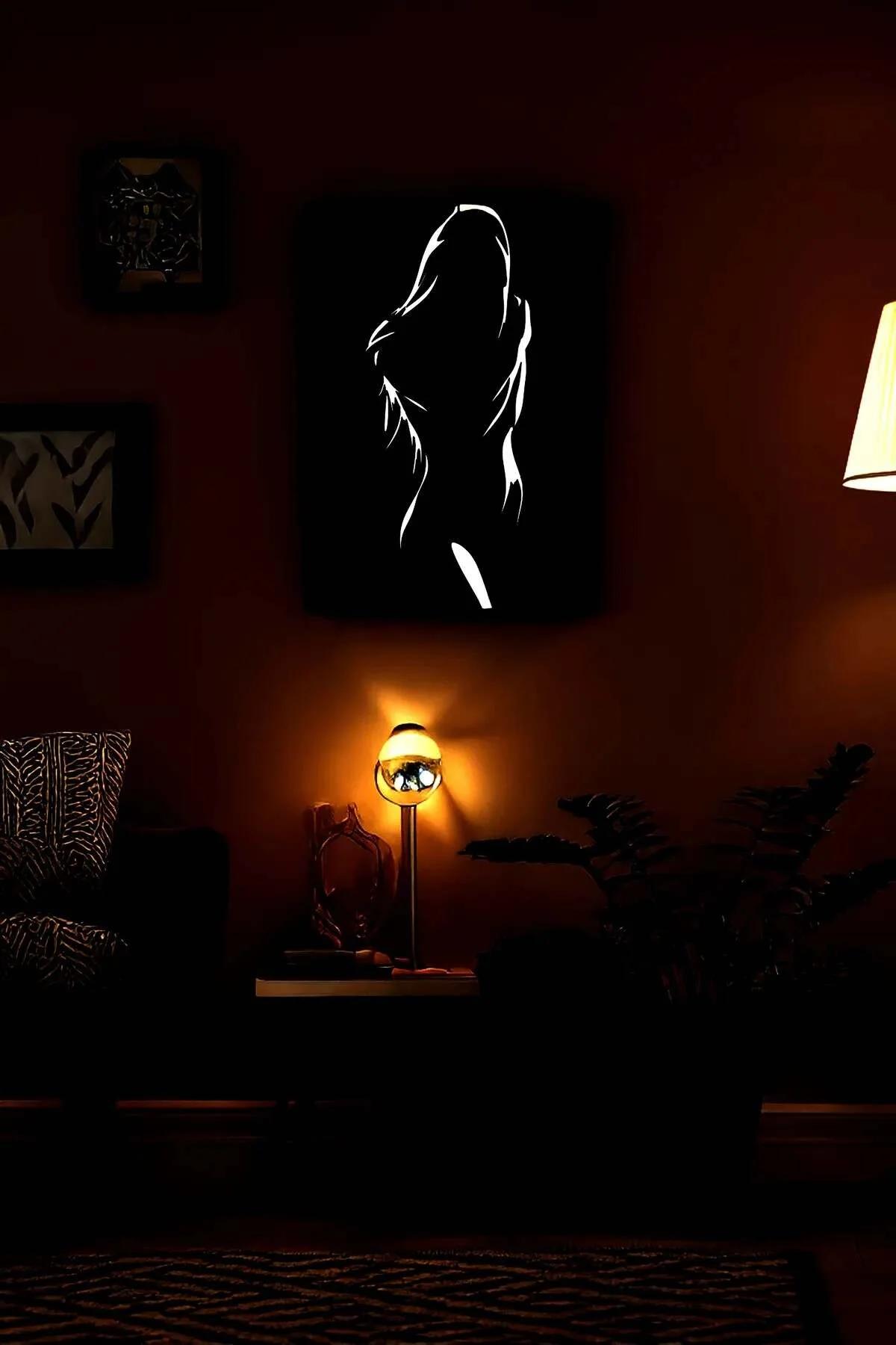Reflective Female Silhouette Art on Black Canvas